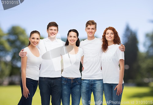 Image of group of smiling teenagers in white blank t-shirts