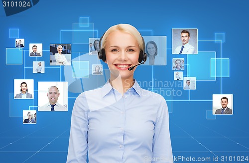 Image of happy female helpline operator with headphones