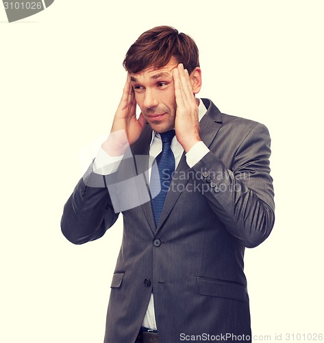 Image of stressed buisnessman or teacher having headache