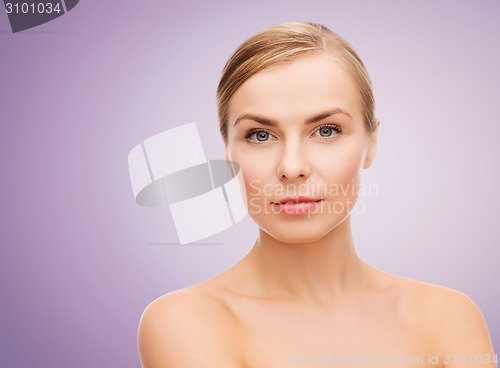 Image of beautiful young woman with bare shoulders