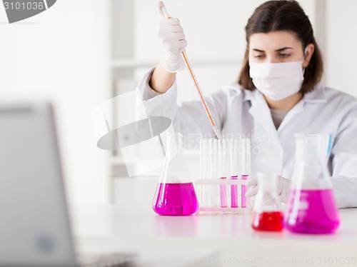 Image of close up of scientist making test in lab