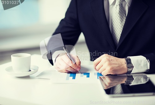 Image of man with tablet pc and cup of coffee