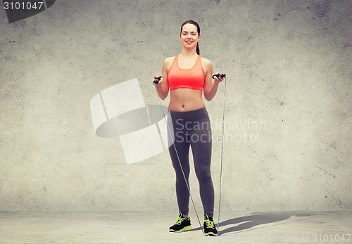 Image of sporty woman with skipping rope