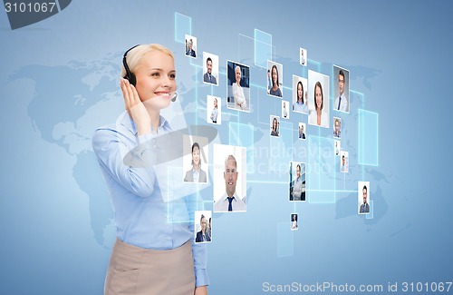 Image of happy female helpline operator with headphones