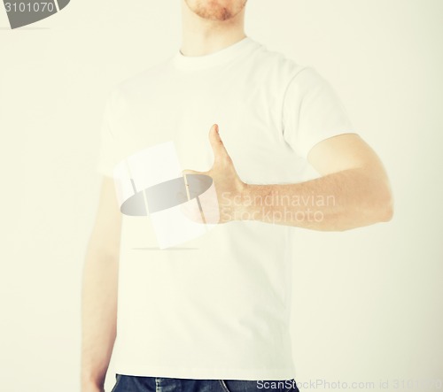 Image of man showing thumbs up