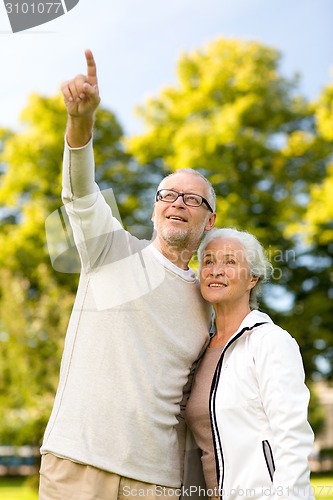 Image of senior couple hugging in park