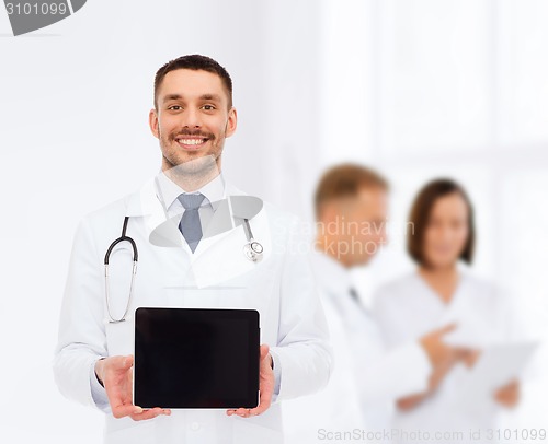 Image of smiling male doctor with tablet pc