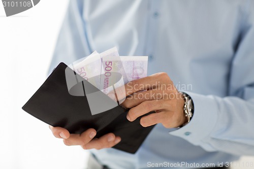 Image of close up of businessman hands holding money