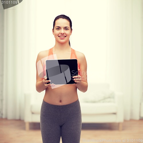 Image of sporty woman with tablet pc blank screen