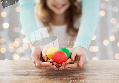 Image of close up of happy family holding easter eggs