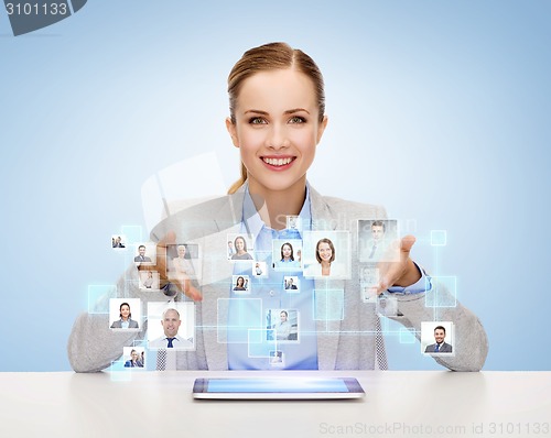 Image of businesswoman with tablet pc and icons of contacts