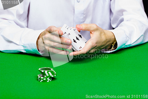 Image of Card player shuffles the cards