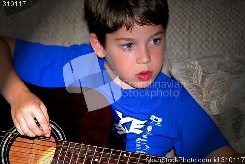 Image of Boy play guitar