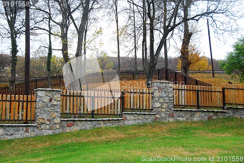 Image of Stone and wooden fence