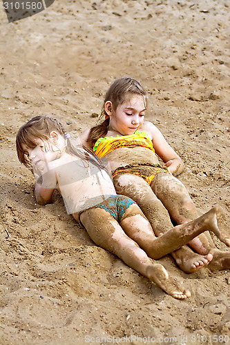 Image of Two girls in the sand