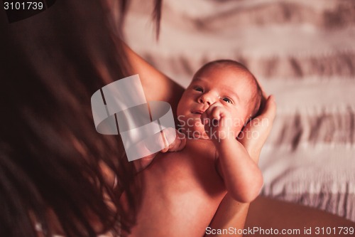 Image of Young mother with baby