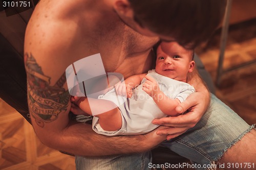 Image of Newborn baby in father hands