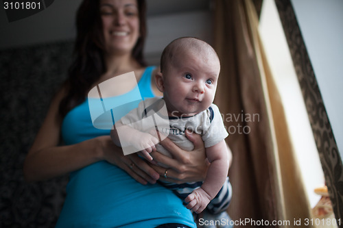 Image of Young mother with baby