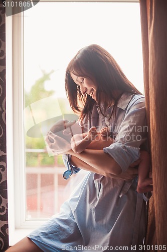 Image of Young mother with baby