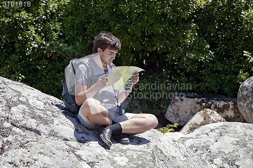 Image of Young tourist with a map