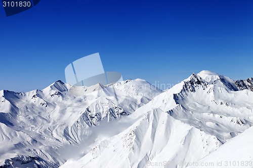 Image of Snowy mountains in sun day