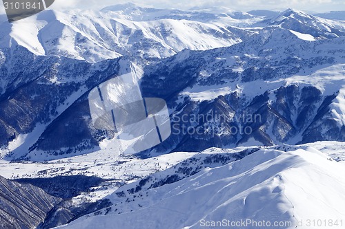 Image of Top view on snowy mountains and off-piste slope