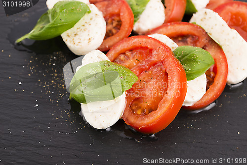 Image of Caprese salad with mozzarella, tomato, basil and balsamic vinega