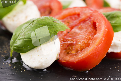 Image of Caprese salad with mozzarella, tomato, basil and balsamic vinega