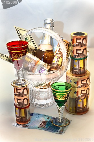 Image of Money, wine, beautiful wine-glasses and vase