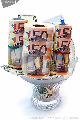 Image of Monetary denominations laid in a vase