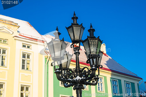 Image of Beautiful street lamp on the background of old buildings