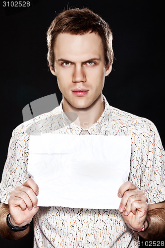 Image of Handsome young man with cardboard