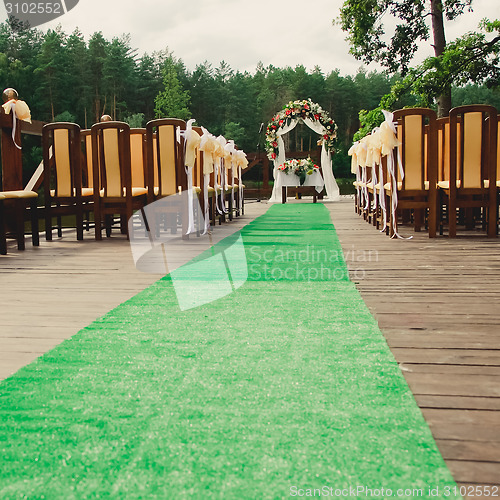 Image of Wedding ceremony in a beautiful garden.