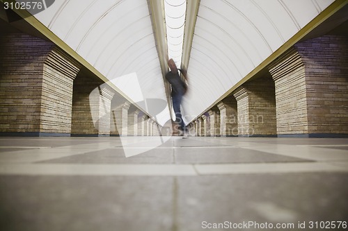 Image of Blurred man on subway platform