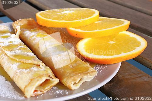 Image of pancakes with oranges