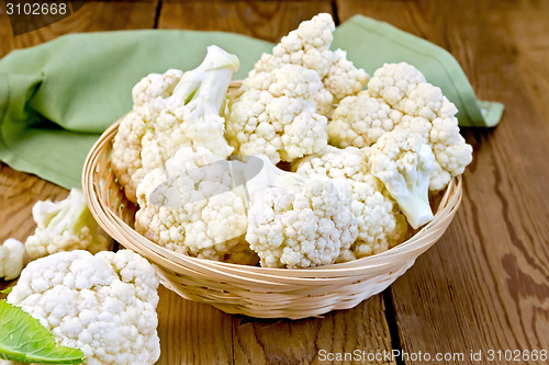 Image of Cauliflower in basket on board