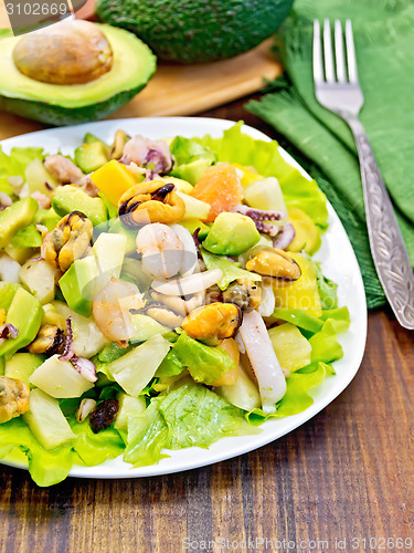 Image of Salad seafood and avocado on dark board