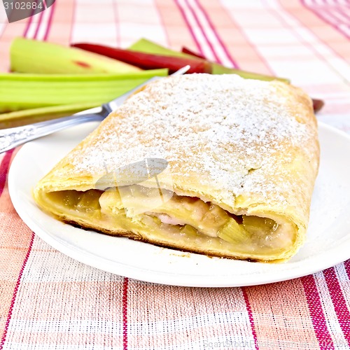Image of Strudel with rhubarb in plate on linen tablecloth