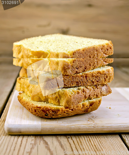 Image of Bread wheat homemade slices on board