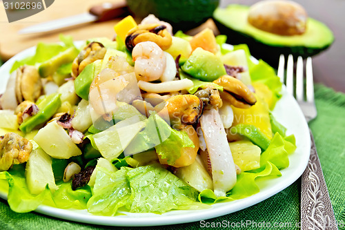 Image of Salad seafood and avocado on napkin