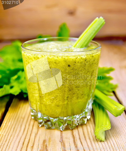 Image of Cocktail with celery in glassful on board