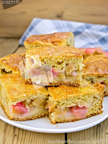 Image of Pie rhubarb in plate and napkin on board