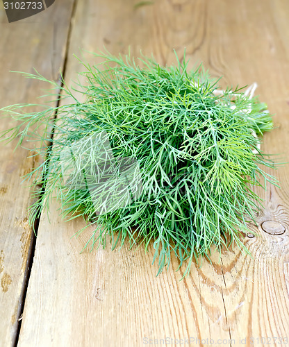 Image of Dill on wooden board