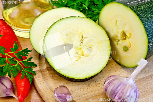 Image of Zucchini with garlic and pepper on board