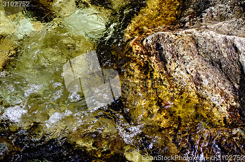 Image of Flow boiling water with stones