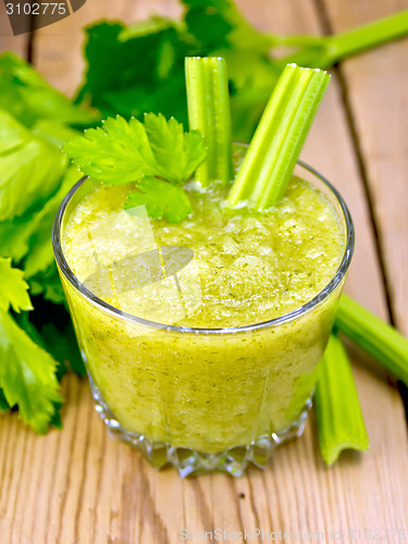 Image of Cocktail with celery in low glassful on board