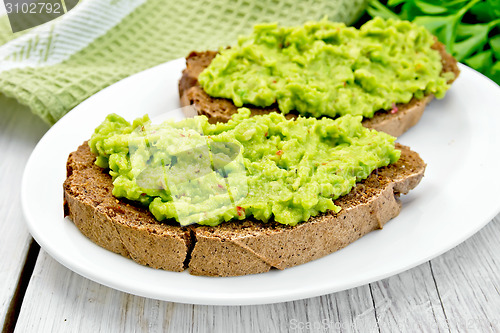 Image of Sandwich with guacamole on light board