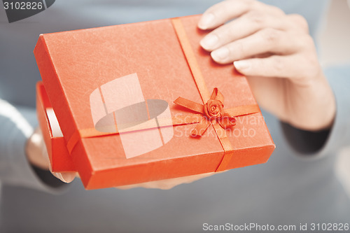 Image of Woman with gift box