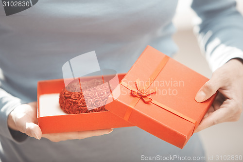 Image of Woman with romantic cake