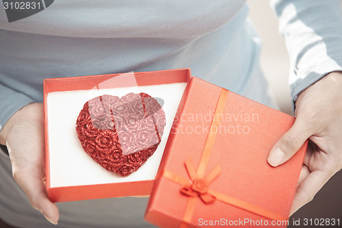 Image of Woman with romantic cake